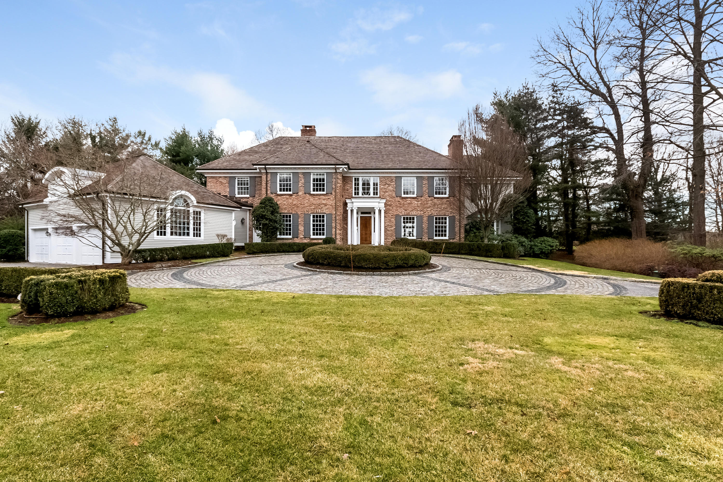 459 Middlesex Road Darien, CT 06820 - Photo 3 of 53 a front view of a house with a yard and trees