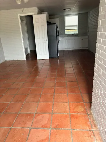 a view of an empty room with windows