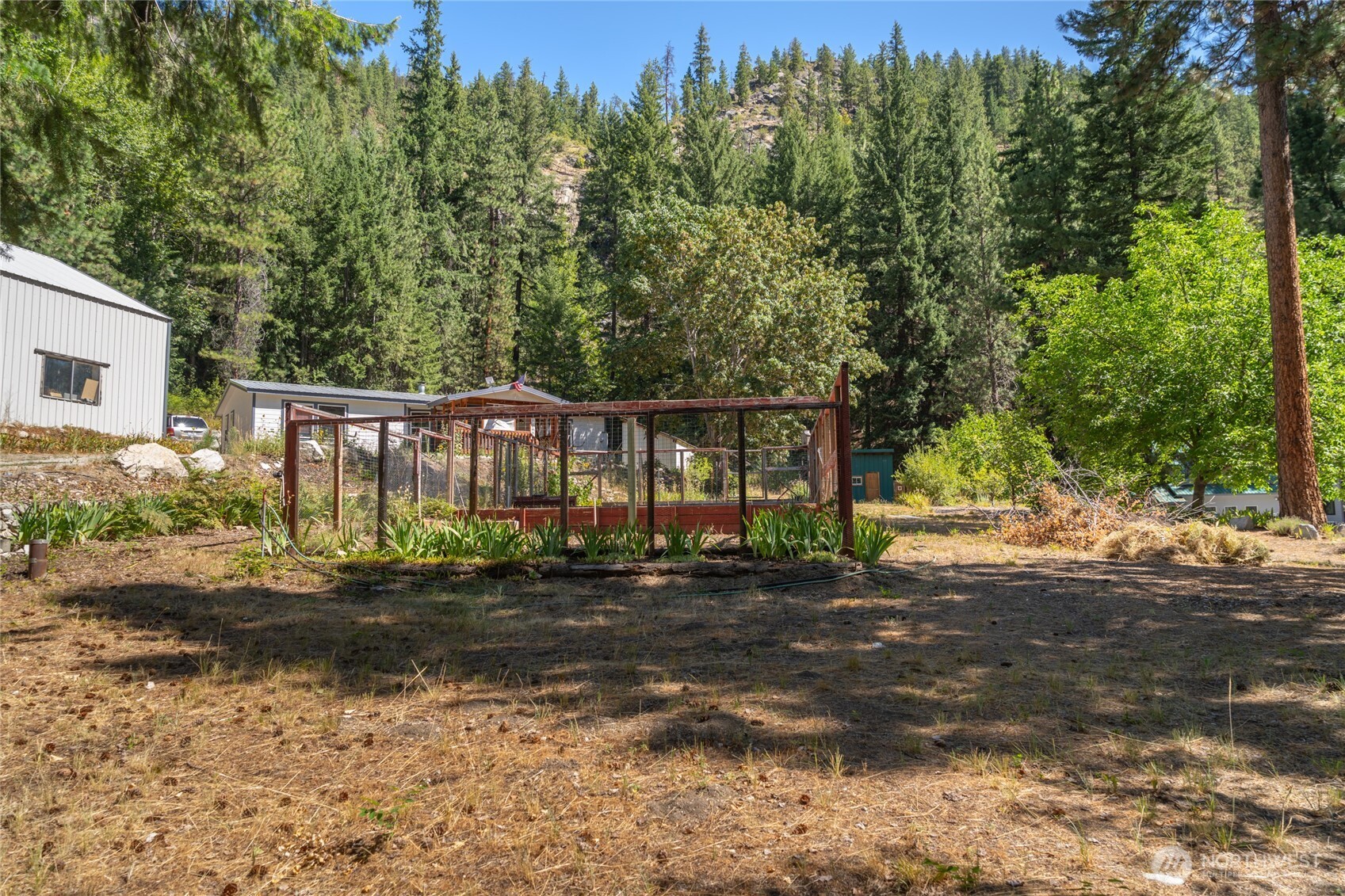 24-mile Entiat River Road Entiat, WA 98822 - Photo 13 of 13 a front view of a house with a yard