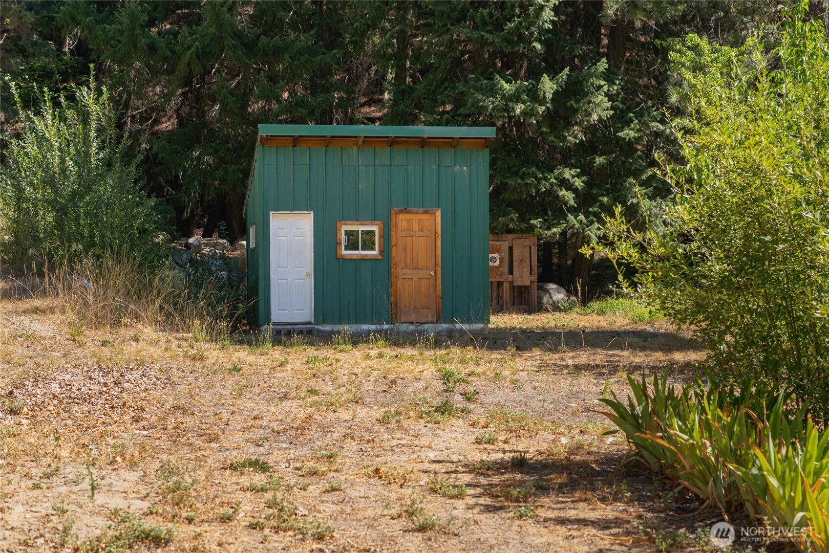 24-mile Entiat River Road Entiat, WA 98822 - Photo 8 of 13 a house with trees in front of it