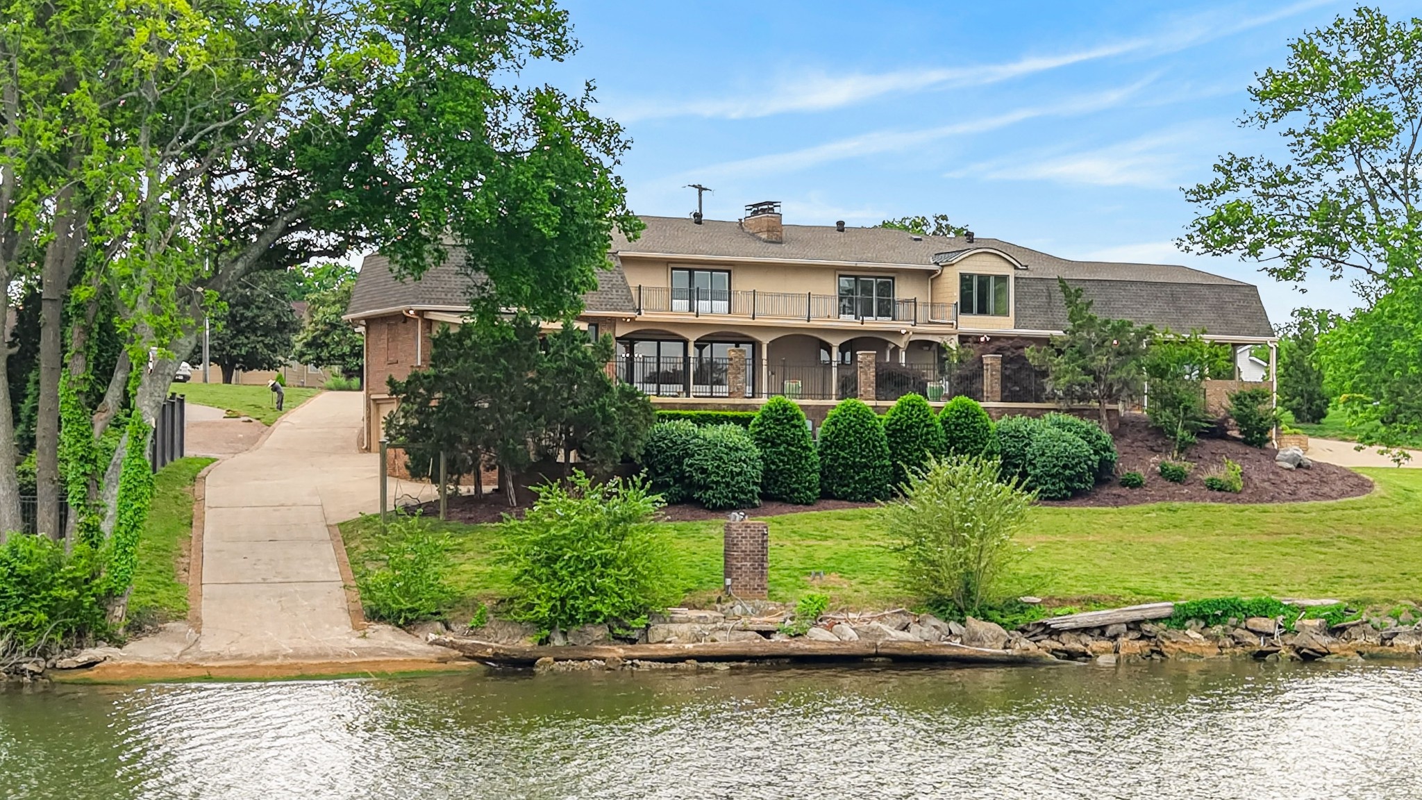 101 Kennett Road Old Hickory, TN 37138 - Photo 19 of 100 a front view of a house with a yard and lake view