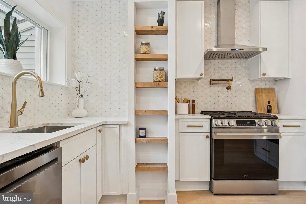 1019 Ellsworth Street Philadelphia, PA 19147 - Photo 11 of 31 a kitchen with cabinets and appliances