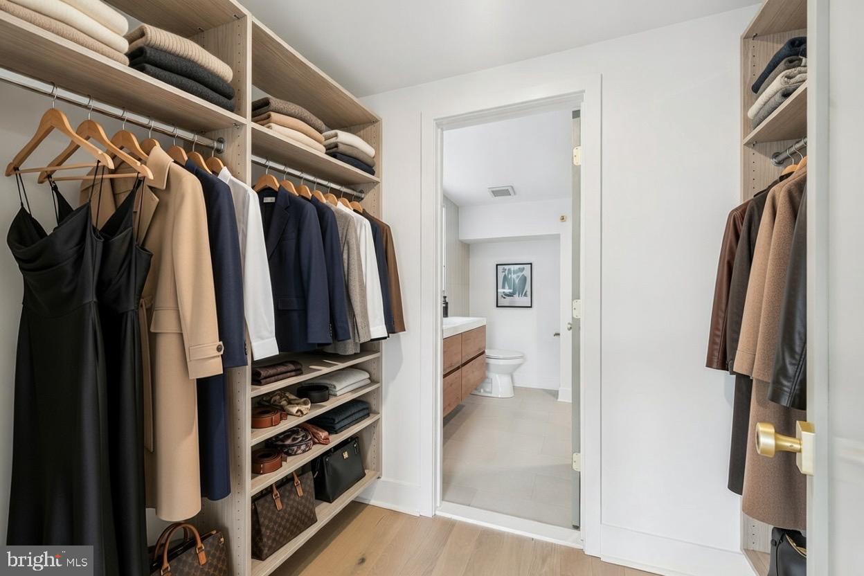 1019 Ellsworth Street Philadelphia, PA 19147 - Photo 18 of 31 a view of walk in closet with clothes and shoes