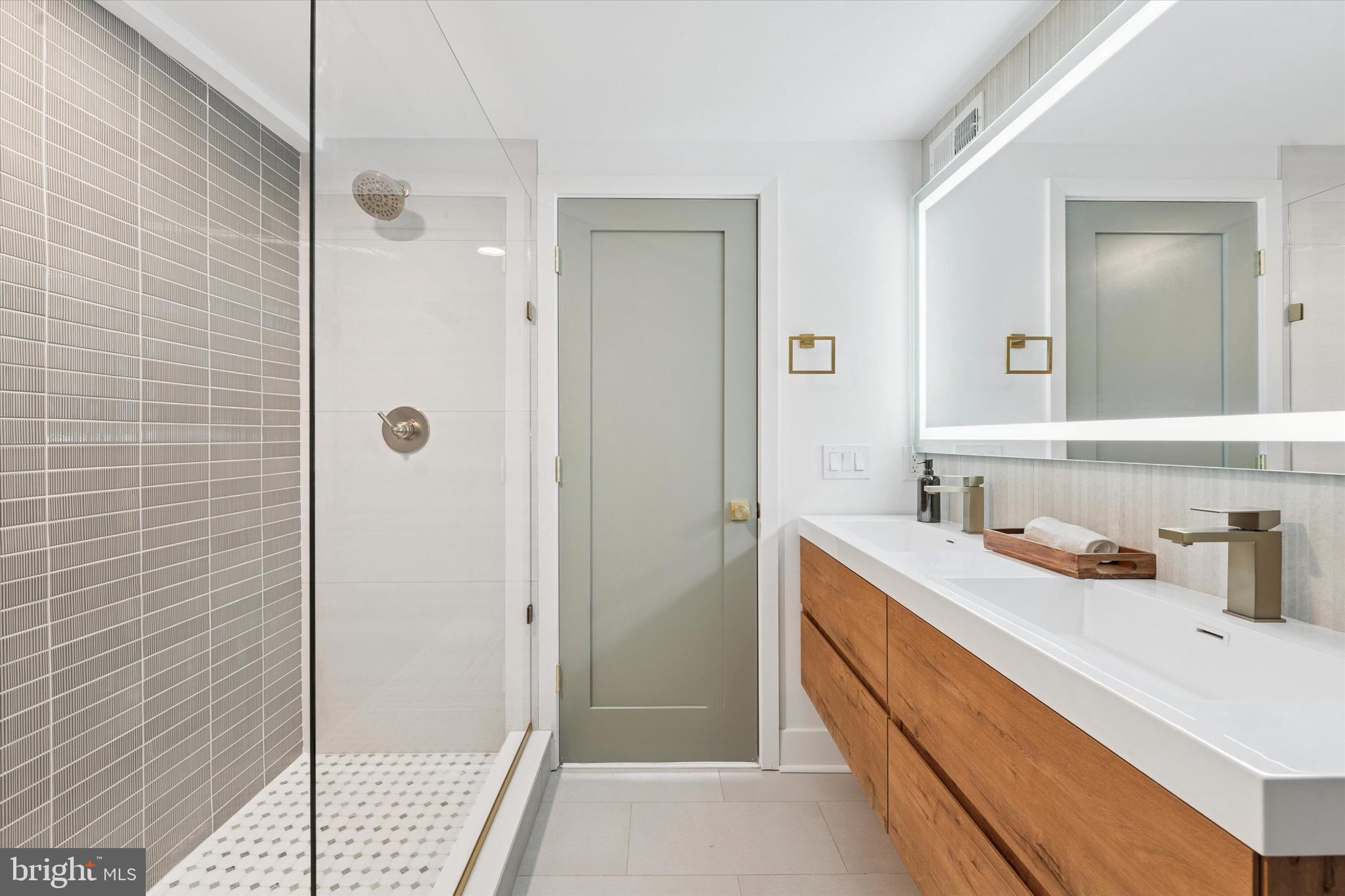 1019 Ellsworth Street Philadelphia, PA 19147 - Photo 19 of 31 a bathroom with a sink and a mirror