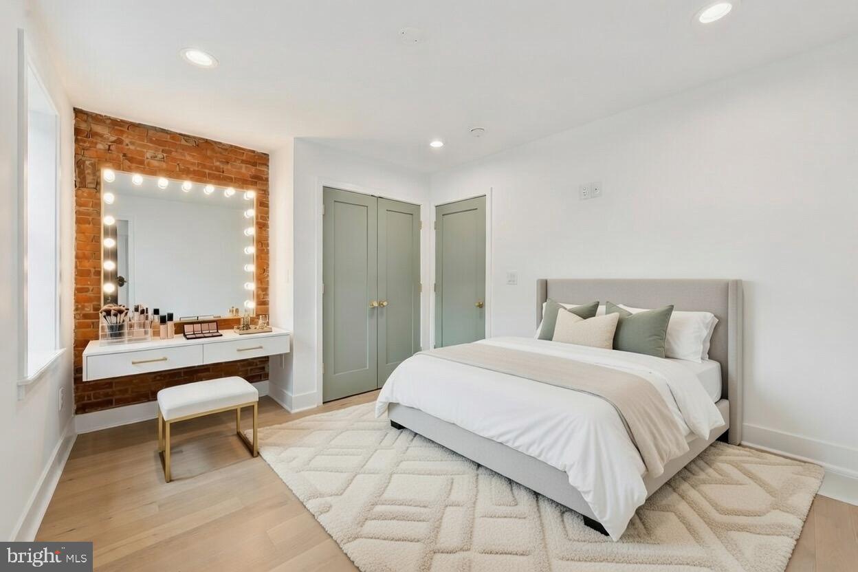 1019 Ellsworth Street Philadelphia, PA 19147 - Photo 21 of 31 a bedroom with a bed and a mirror