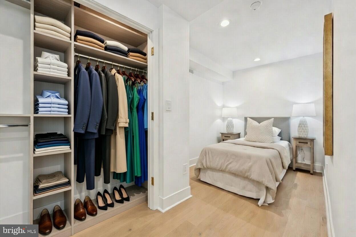 1019 Ellsworth Street Philadelphia, PA 19147 - Photo 22 of 31 a bedroom with a large bed and a walk in closet