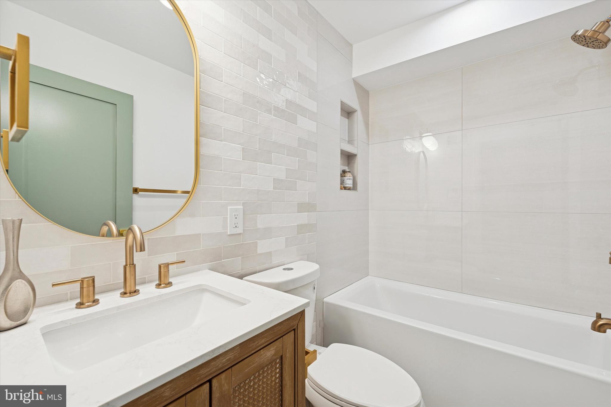 1019 Ellsworth Street Philadelphia, PA 19147 - Photo 23 of 31 a bathroom with a sink toilet vanity and bathtub