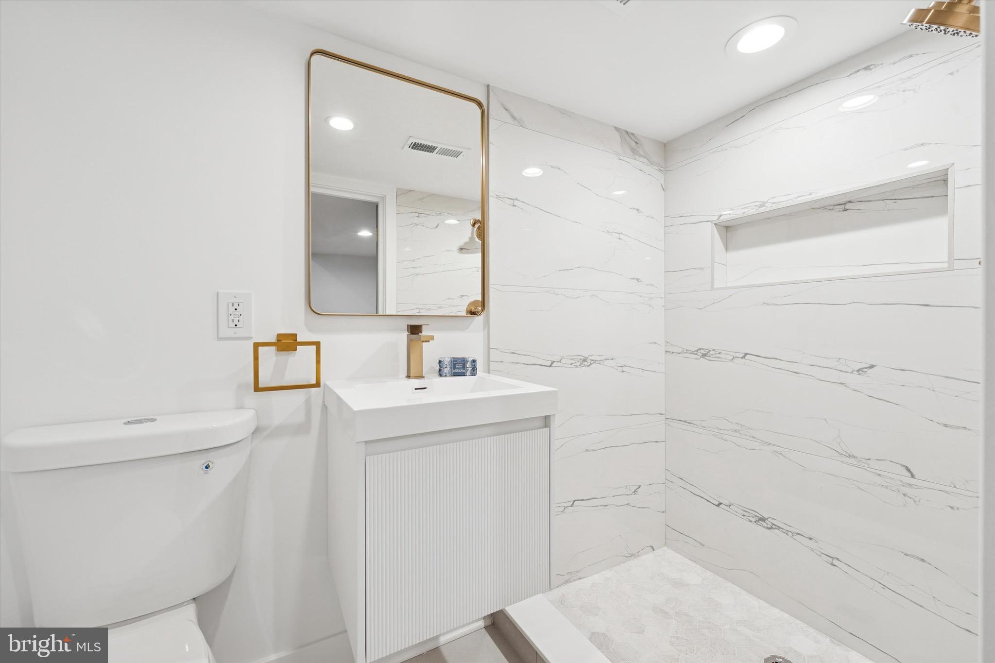 1019 Ellsworth Street Philadelphia, PA 19147 - Photo 26 of 31 a bathroom with a sink toilet and shower