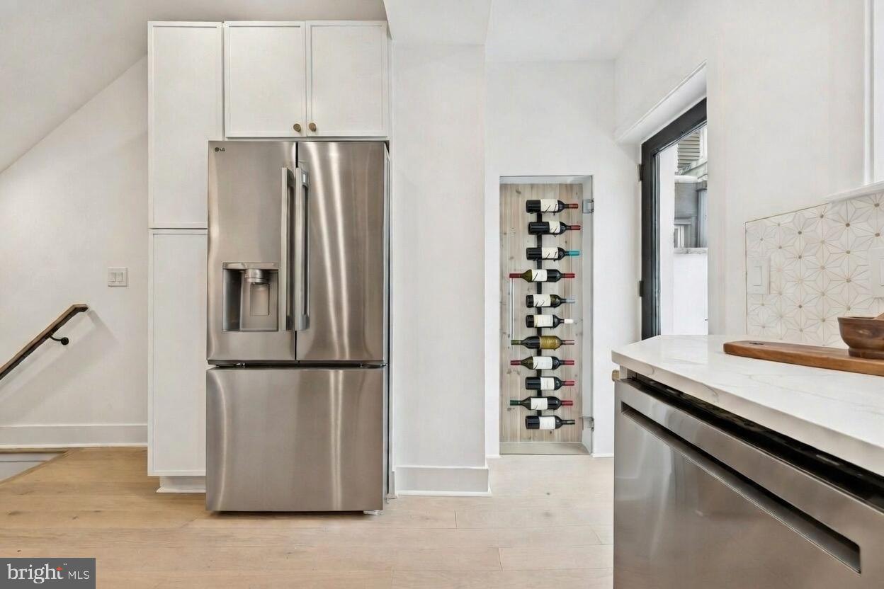 1019 Ellsworth Street Philadelphia, PA 19147 - Photo 4 of 31 a kitchen with granite countertop a refrigerator and a sink