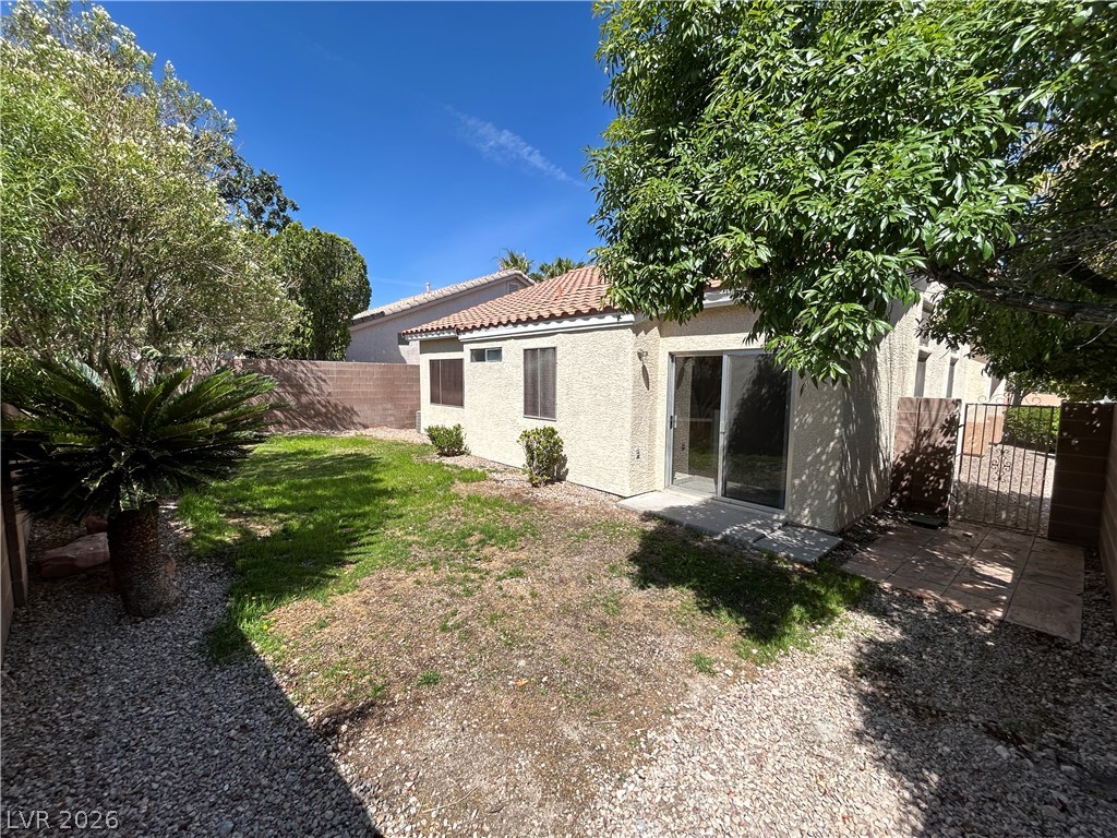 1840 Montvale Las Vegas, NV 89134 - Photo 29 of 31 A private yard offers a pleasant outdoor retreat with mature landscaping and convenient access.