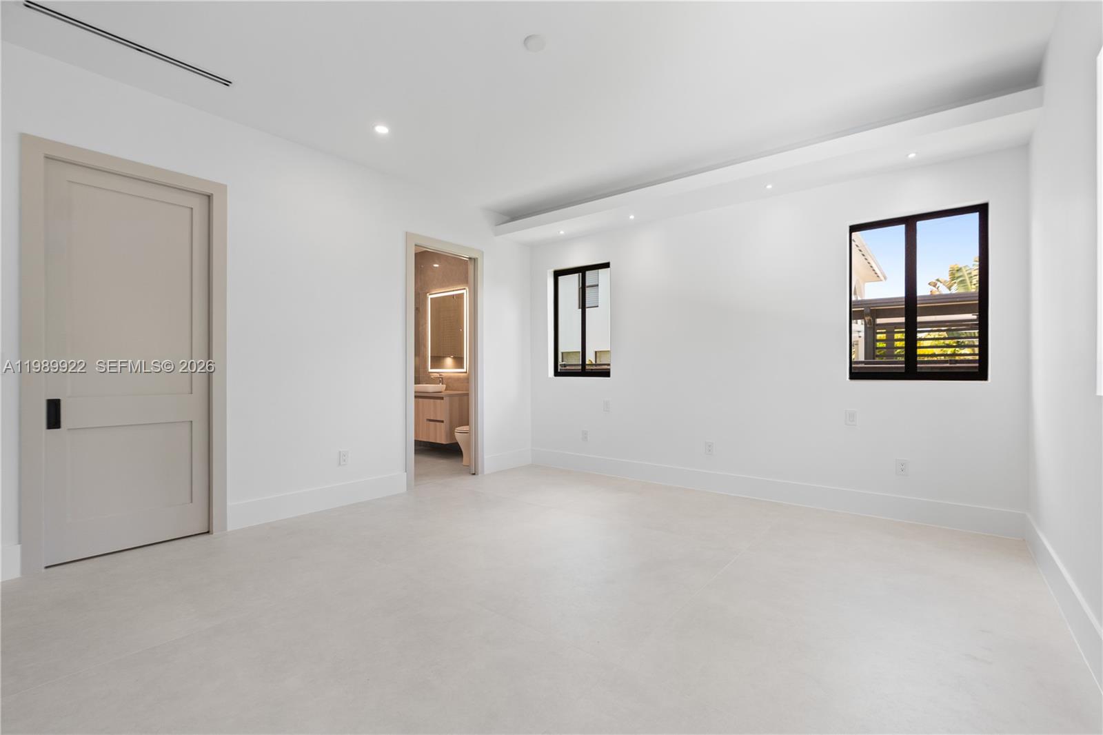 6221 Southwest 60th Street South Miami, FL 33143 - Photo 14 of 42 an empty room with windows and closet