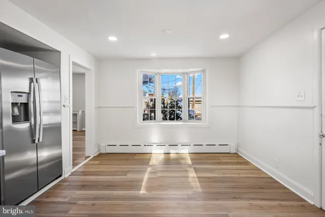 a view of a living room with a hard wood floor