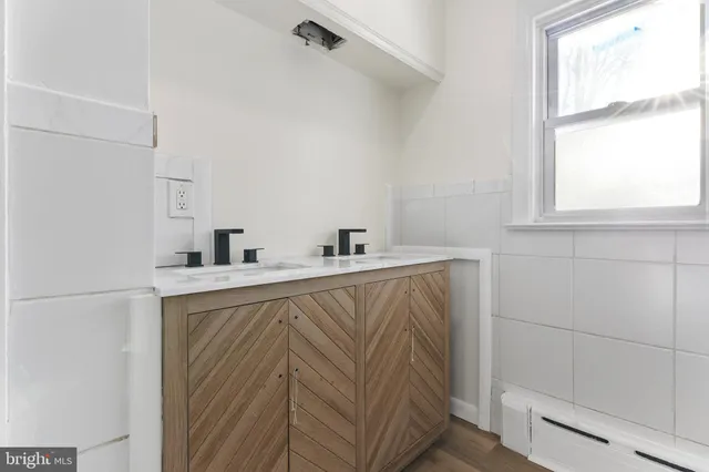 a kitchen with a sink and a window