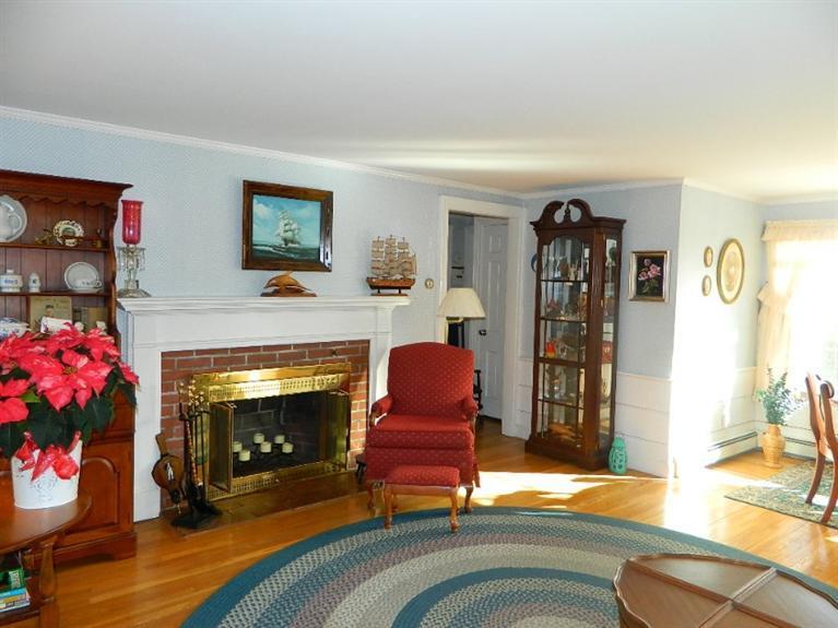 11 Harbor Bluff Road Hyannis, MA 02601 - Photo 12 of 30 a living room with furniture and a fireplace