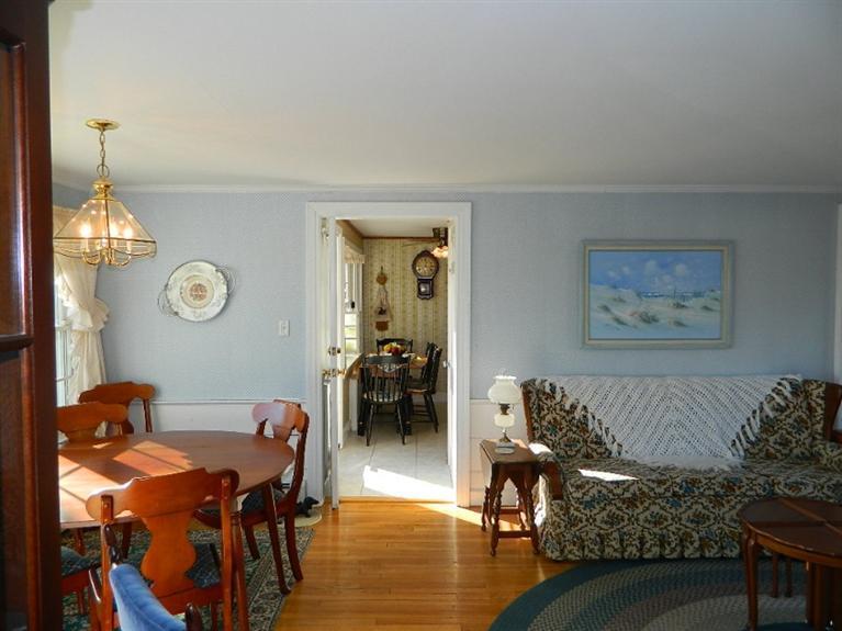11 Harbor Bluff Road Hyannis, MA 02601 - Photo 13 of 30 a living room with furniture and a table