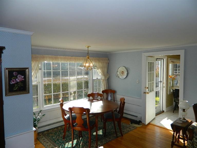 11 Harbor Bluff Road Hyannis, MA 02601 - Photo 14 of 30 a view of a dining room with furniture window and outside view