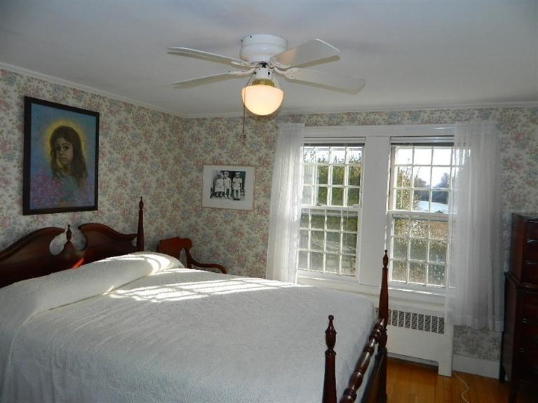 11 Harbor Bluff Road Hyannis, MA 02601 - Photo 21 of 30 a bedroom with a bed and a window