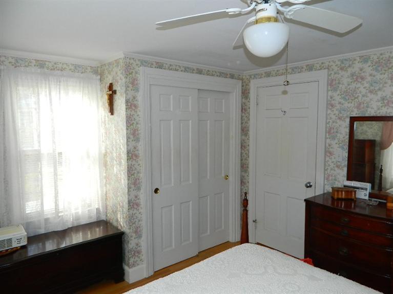 11 Harbor Bluff Road Hyannis, MA 02601 - Photo 23 of 30 a bedroom with a bed and a dresser