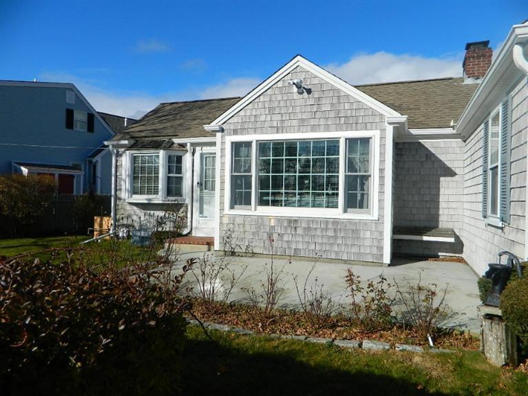 11 Harbor Bluff Road Hyannis, MA 02601 - Photo 6 of 30 a front view of a house with a yard