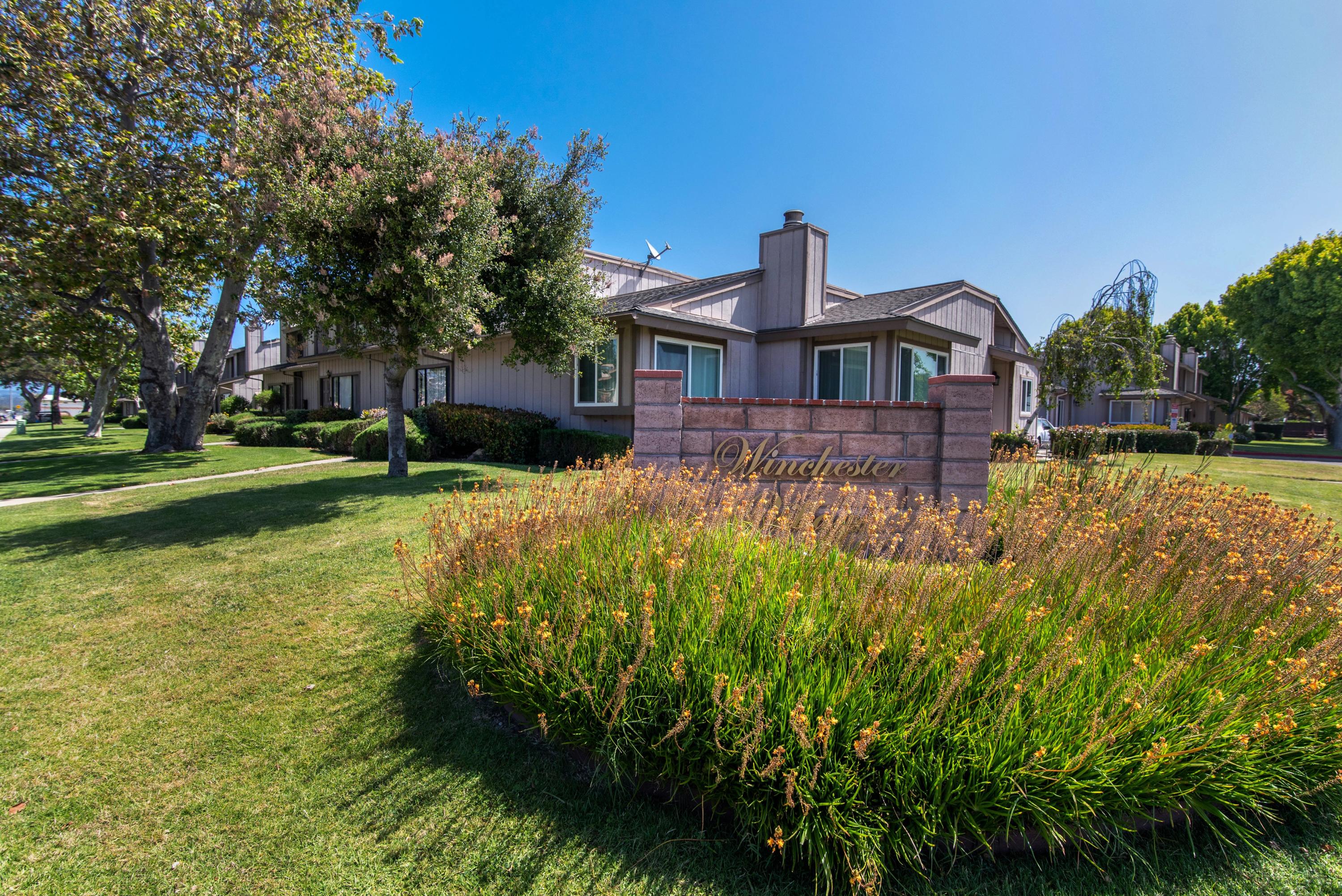 202 North R Street Lompoc, CA 93436 - Photo 1 of 12 a house that has a lot of plants in it