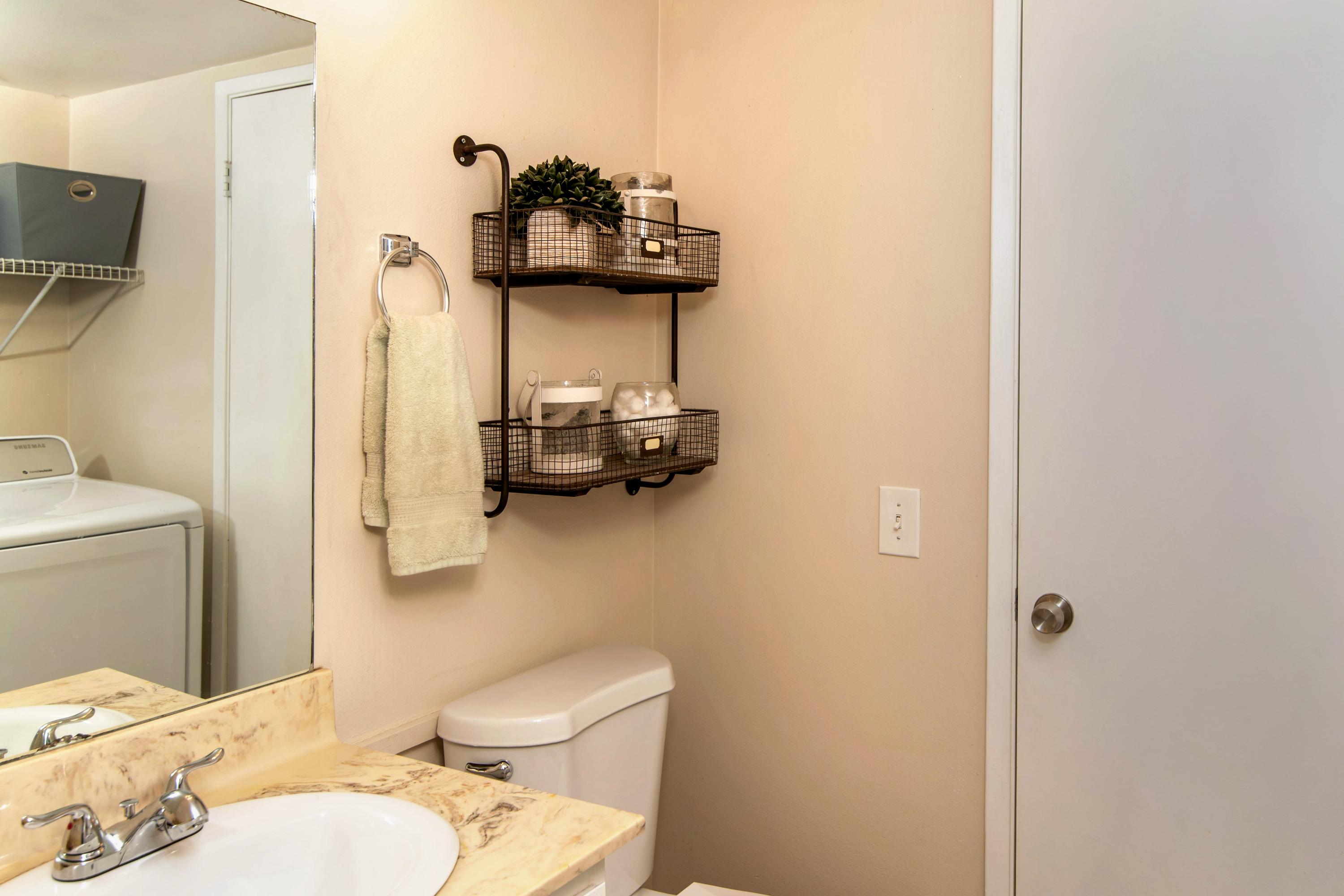 202 North R Street Lompoc, CA 93436 - Photo 7 of 12 a bathroom with a toilet sink and mirror