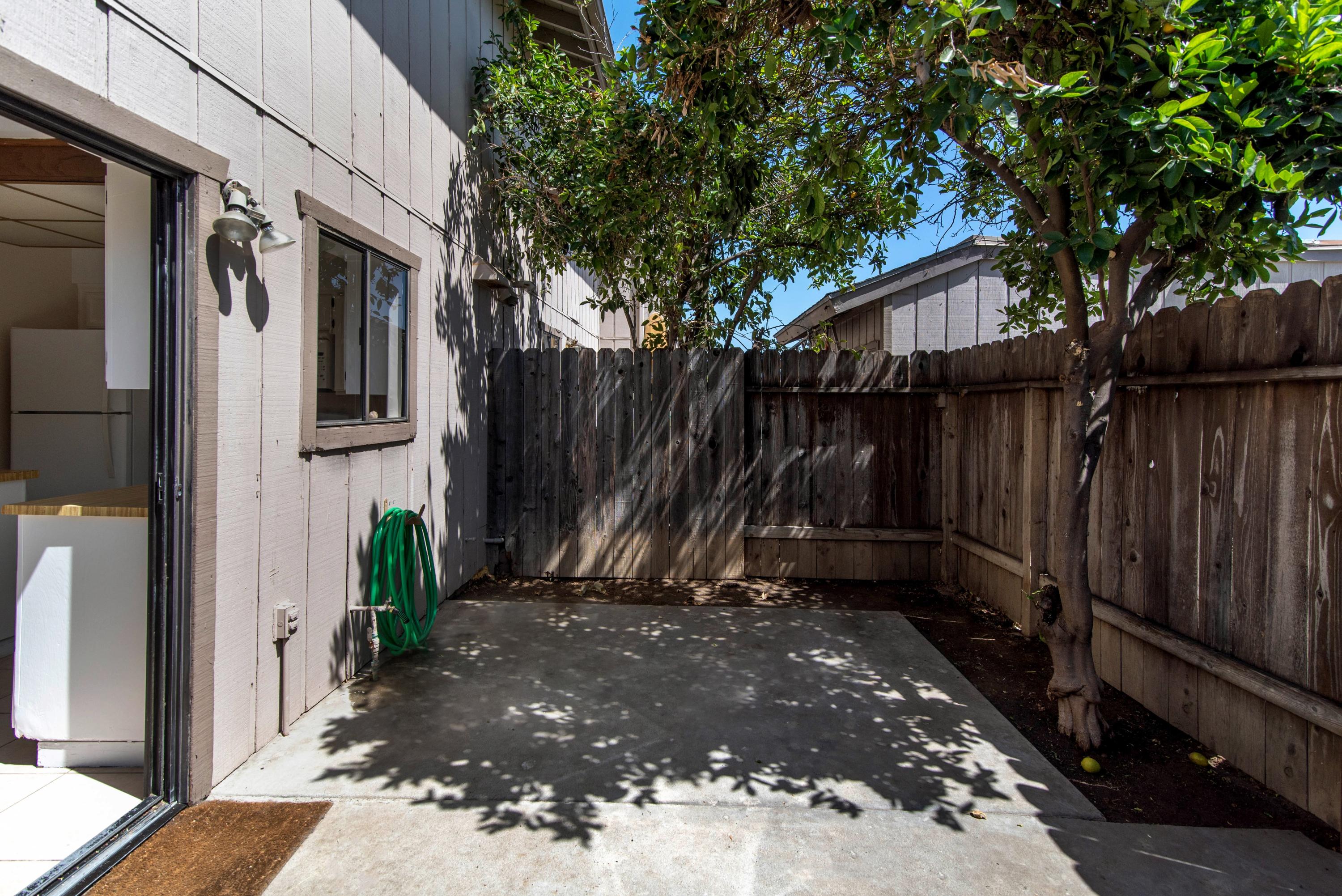 202 North R Street Lompoc, CA 93436 - Photo 8 of 12 a view of a house with a backyard