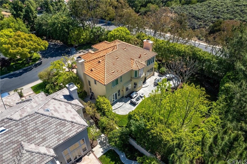 22 Meryton Irvine, CA 92603 - Photo 33 of 37 an aerial view of a house with a yard and large trees