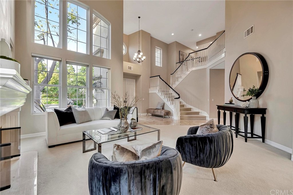 22 Meryton Irvine, CA 92603 - Photo 4 of 37 a living room with furniture a rug and a window
