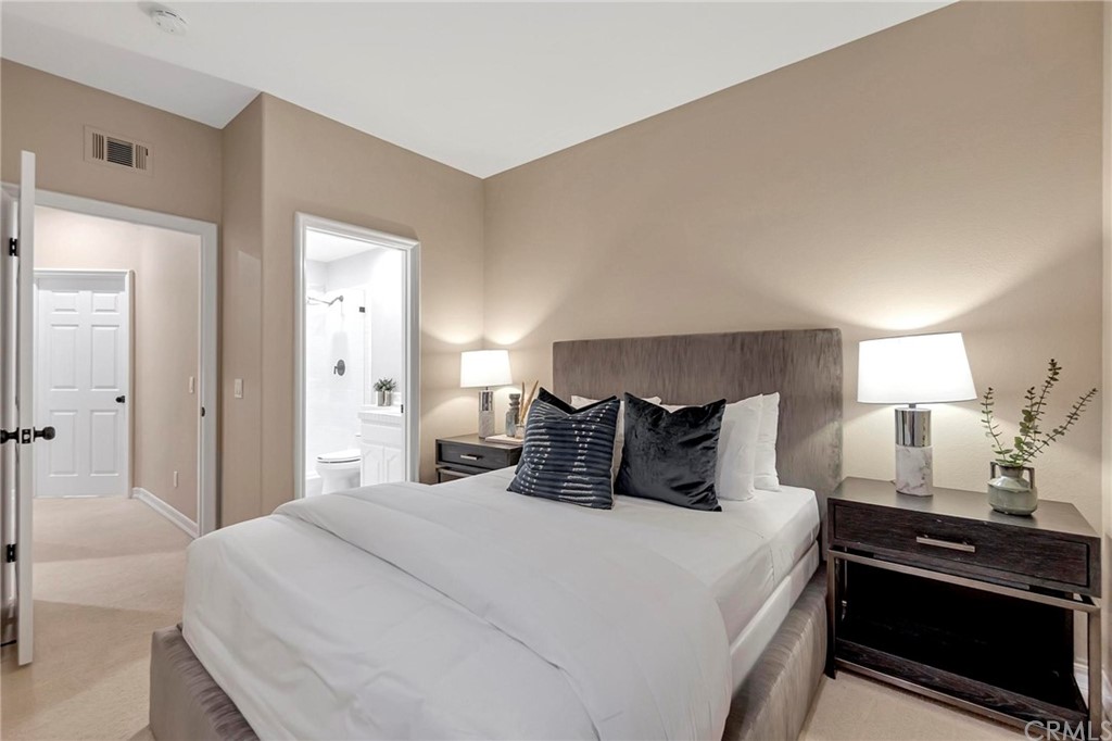 22 Meryton Irvine, CA 92603 - Photo 7 of 37 a bedroom with a bed and a lamp