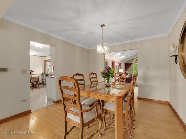 28W241 Garys Mill Road Winfield, IL 60190 - Photo 8 of 34 a view of a dining room with furniture and chandelier