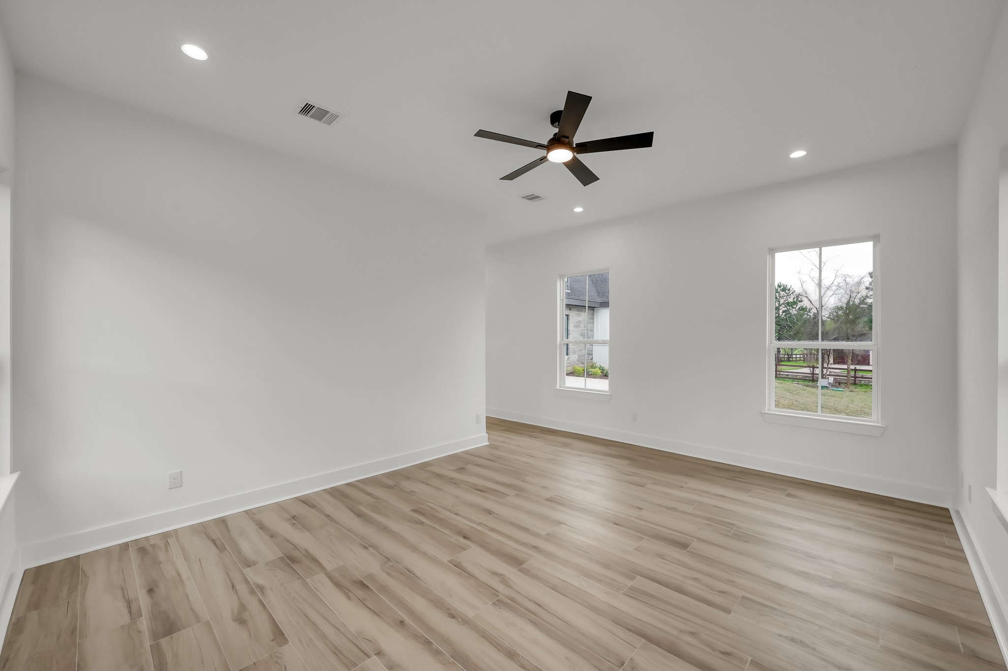 14742 Turquoise Trail Willis, TX 77378 - Photo 26 of 48 Primary suite perspective showing the entry to the hallway and sliding barn-style doors leading toward the primary bath area.