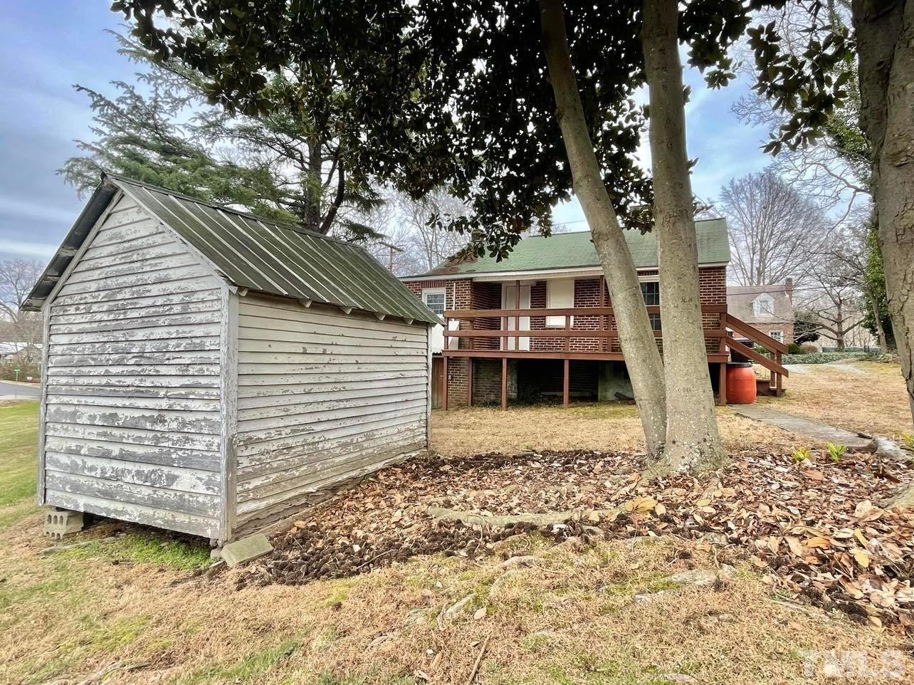 207 Broad Street Roxboro, NC 27573 - Photo 11 of 17 a view of a house with a yard