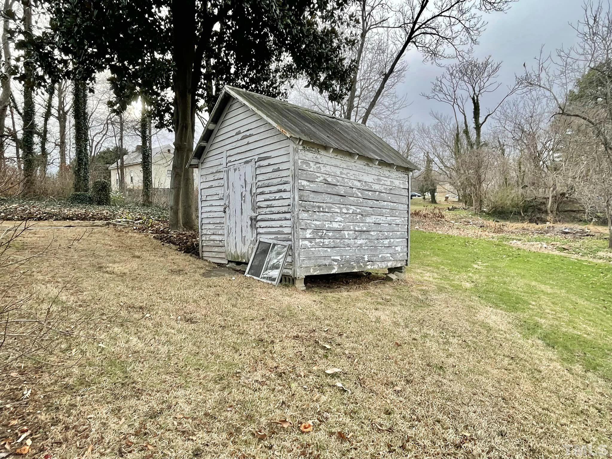 207 Broad Street Roxboro, NC 27573 - Photo 16 of 17 a view of a house with a yard