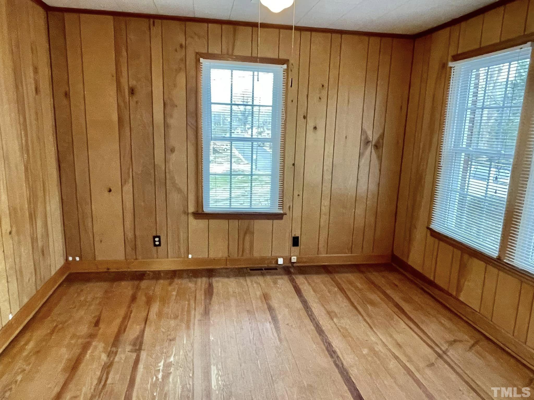 207 Broad Street Roxboro, NC 27573 - Photo 4 of 17 a view of a room with wooden floor and stairs