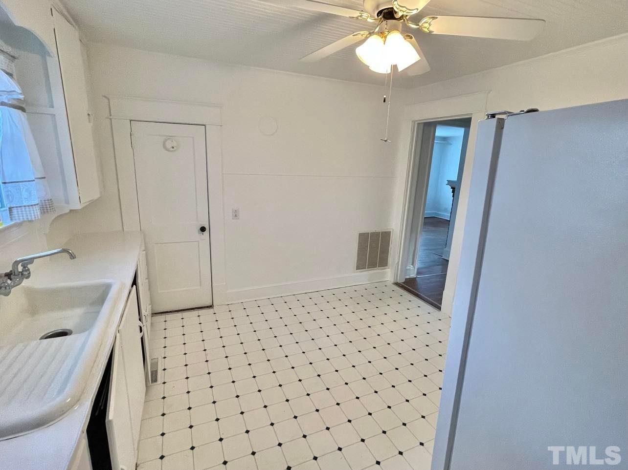 207 Broad Street Roxboro, NC 27573 - Photo 9 of 17 a bedroom with a sink and a mirror
