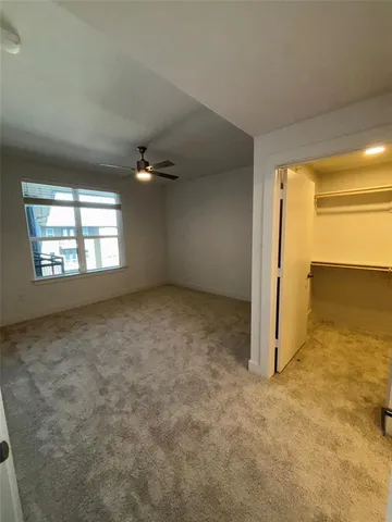 an empty room with a empty space and windows