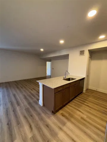 a living room with a wooden floor