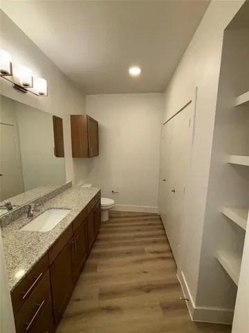 a bathroom with a sink and a large mirror
