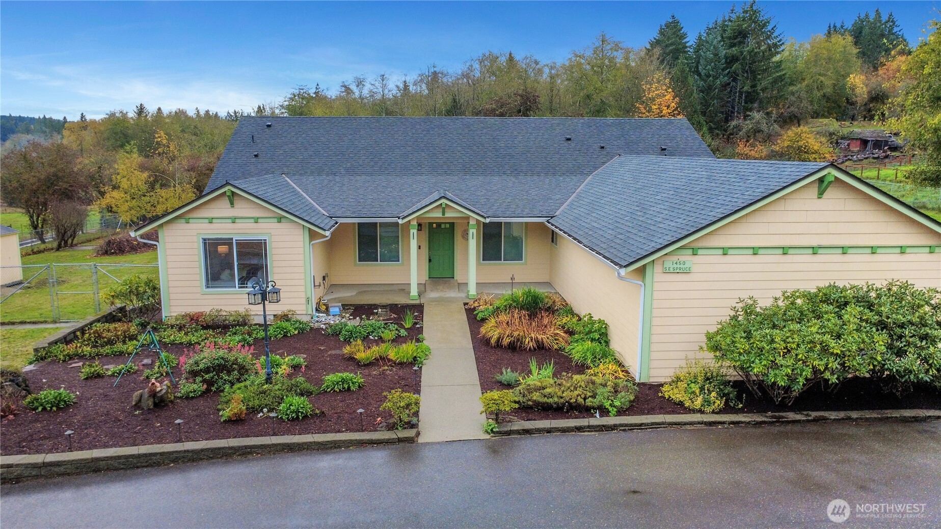 1450 Southeast Spruce Road Port Orchard, WA 98367 - Photo 1 of 35 a house view with a garden space