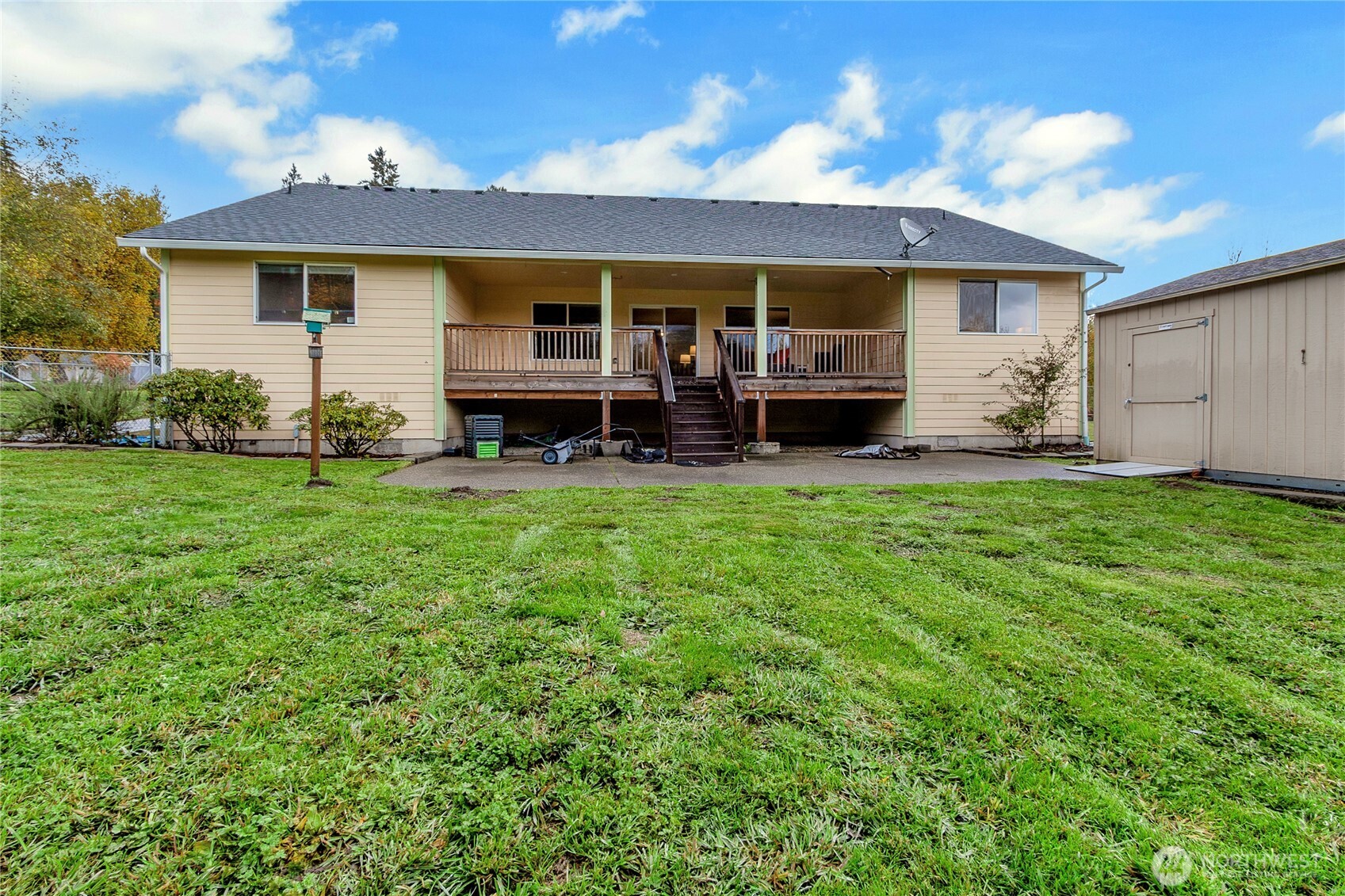 1450 Southeast Spruce Road Port Orchard, WA 98367 - Photo 16 of 35 a view of a house with a yard and sitting area