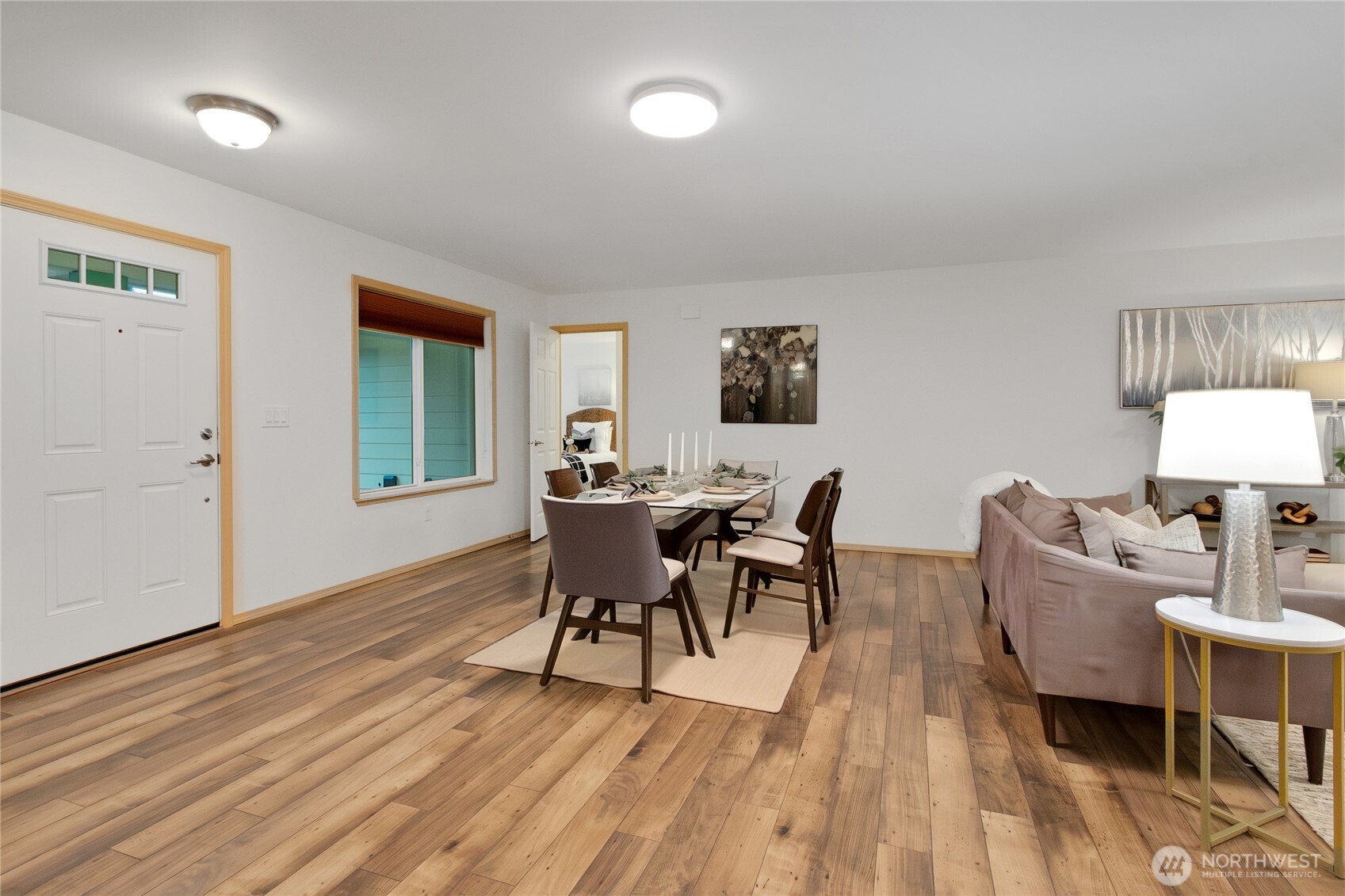 1450 Southeast Spruce Road Port Orchard, WA 98367 - Photo 5 of 35 a view of a dining room with furniture and wooden floor