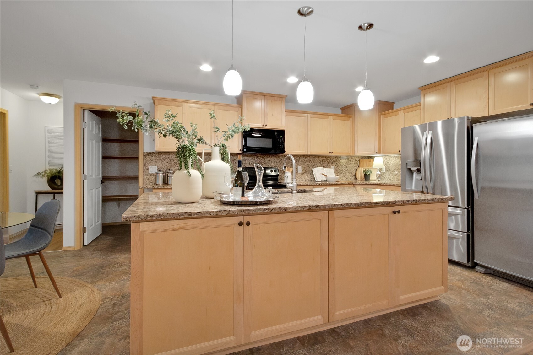 1450 Southeast Spruce Road Port Orchard, WA 98367 - Photo 7 of 35 a kitchen with stainless steel appliances granite countertop a refrigerator a sink and a stove