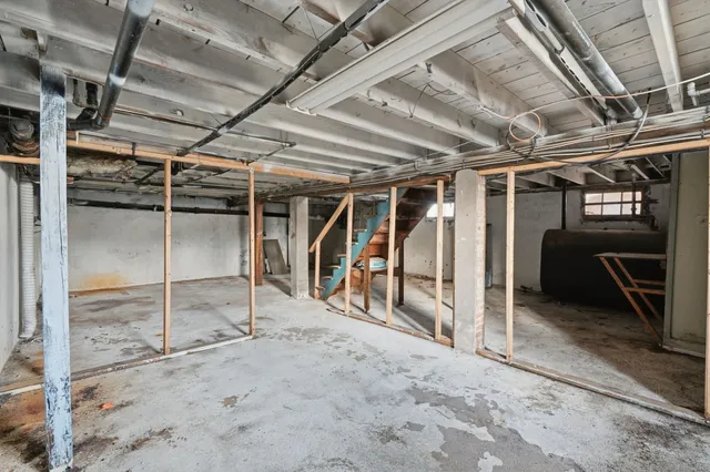 a view of an empty room with wooden walls
