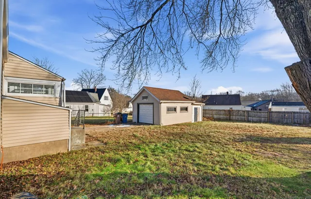 a house that has a tree in front of it