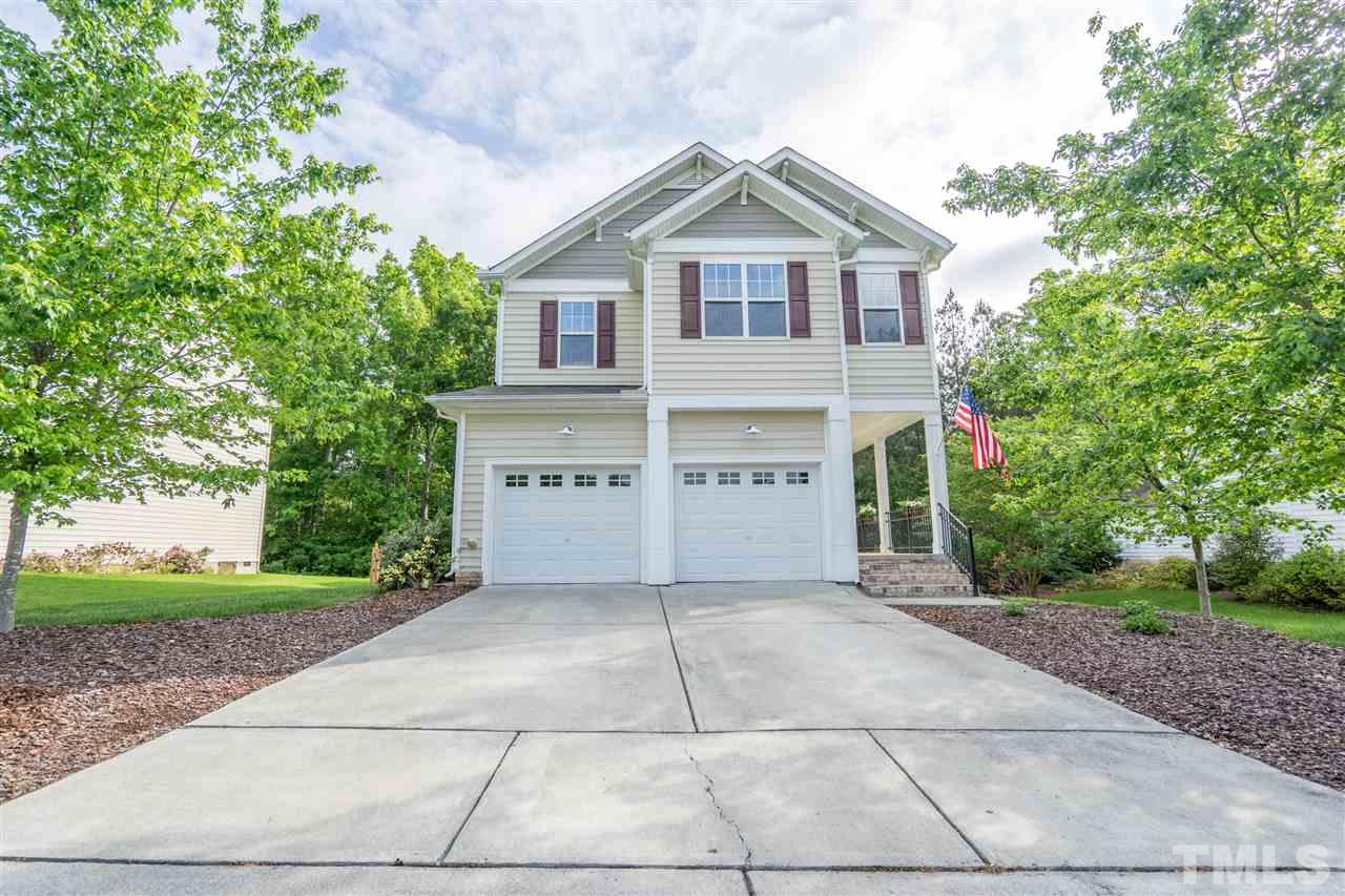 3307 Ranbir Drive Durham, NC 27713 - Photo 1 of 25 a view of a house with a yard and large trees