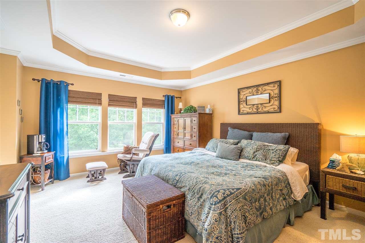 3307 Ranbir Drive Durham, NC 27713 - Photo 12 of 25 a bedroom with a bed and glass windows