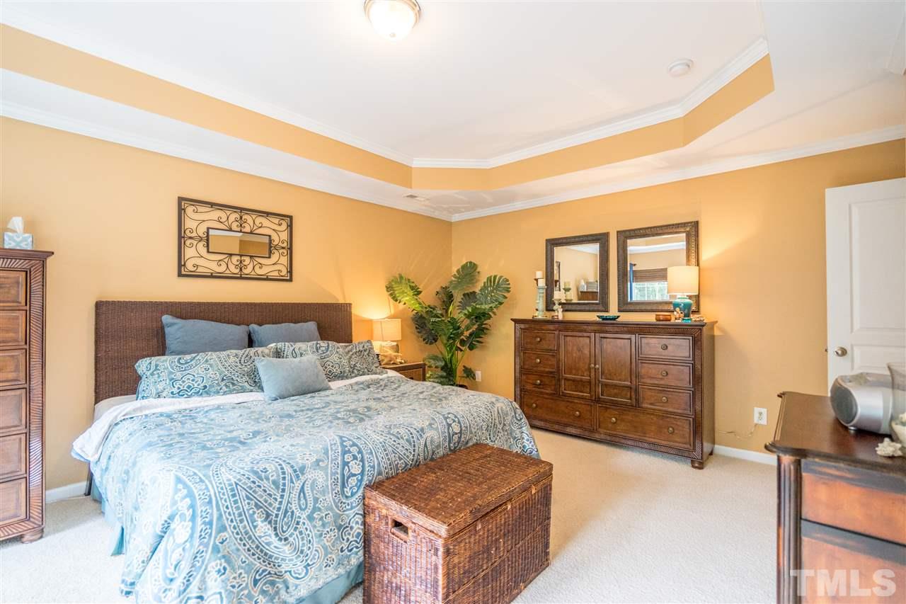 3307 Ranbir Drive Durham, NC 27713 - Photo 13 of 25 a bedroom with a bed and dresser