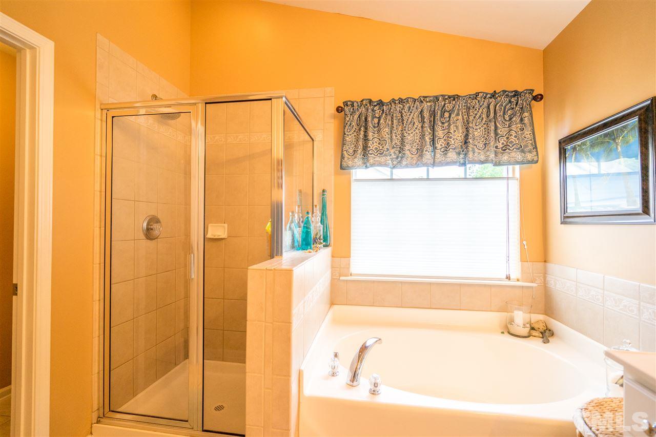 3307 Ranbir Drive Durham, NC 27713 - Photo 15 of 25 a bathroom with a bathtub and a shower