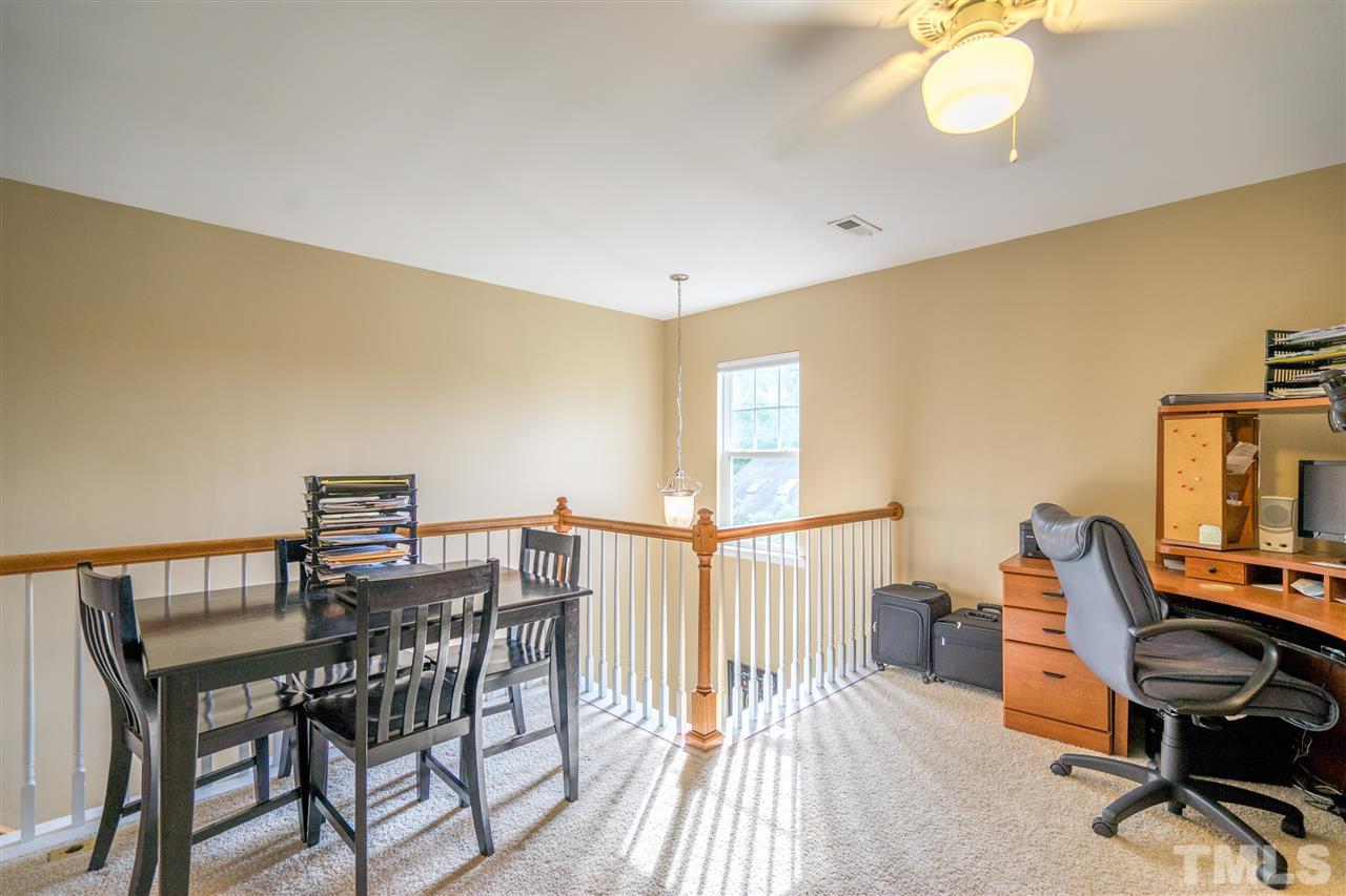 3307 Ranbir Drive Durham, NC 27713 - Photo 17 of 25 a view of a workspace with furniture and a window