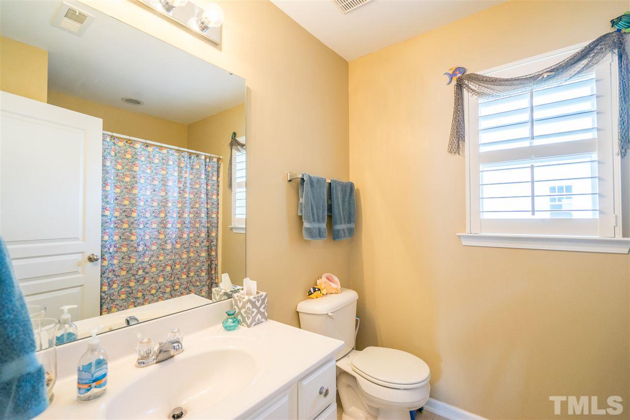 3307 Ranbir Drive Durham, NC 27713 - Photo 19 of 25 a bathroom with a sink toilet and shower